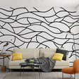Black wave abstract wallpaper creating dramatic impact in a modern minimalist living room with white furniture