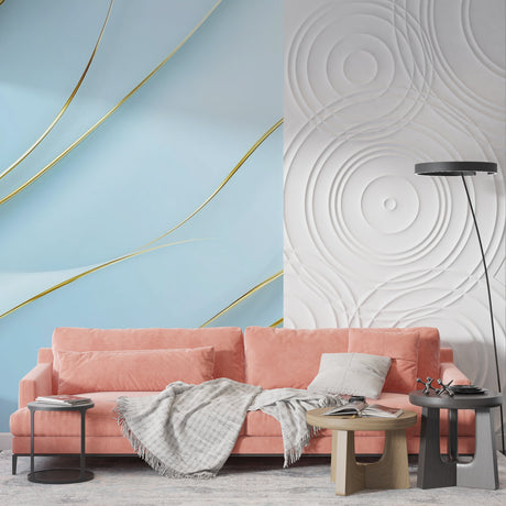 Blue and gold wave wallpaper mural creating movement in modern living room with grey sofa