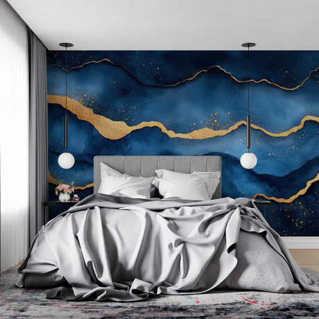 Blue and gold abstract wallpaper creating depth in modern living room with grey sofa
