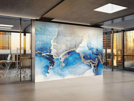 Blue and silver marble wallpaper creating a stunning feature wall in a modern living room with natural lighting