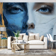Abstract blue and white portrait mural wallpaper creating dramatic impact in modern living room setting
