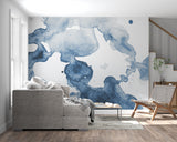 Blue abstract wallpaper in dining room with modern chandelier and wooden table