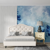 Contemporary hallway featuring abstract blue watercolor wall mural in natural lighting