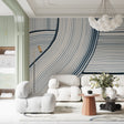 Blue wave line pattern wallpaper in a modern living room with white furniture and natural light