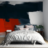 Abstract red and black brushstroke wallpaper creating dramatic impact in modern living room with white sofa
