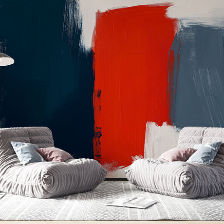 Abstract red and navy brushstroke wallpaper creating dramatic impact in a modern living room with white furniture