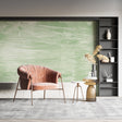 Green abstract wallpaper mural in modern living room with minimalist furniture and natural light