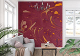 Gold and burgundy abstract wallpaper adding luxury to a home office space