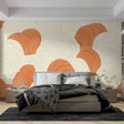 Modern abstract curved lines wallpaper in orange and beige tones creating a warm atmosphere in a minimalist living room