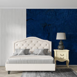 Deep blue abstract wallpaper creating dramatic accent wall in modern living room with minimalist furniture
