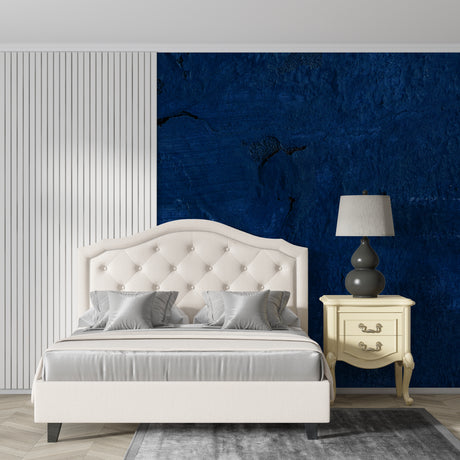 Deep blue abstract wallpaper creating dramatic accent wall in modern living room with minimalist furniture