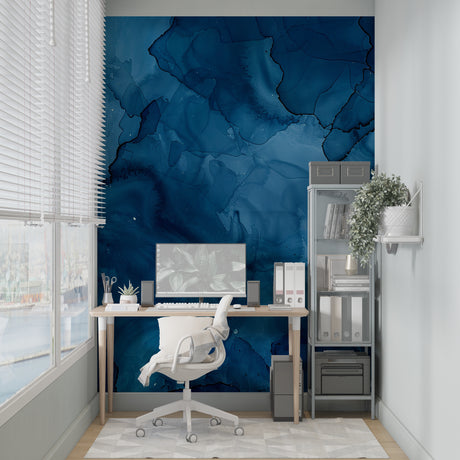 Blue abstract watercolor wallpaper in modern living room with natural light highlighting fluid patterns