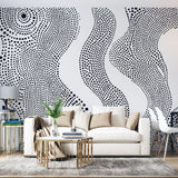 Modern living room featuring Abstract Dot Wave Wallpaper in black and white, creating a stunning accent wall behind a minimalist sofa