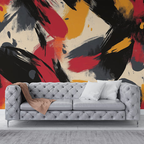 Abstract red and gold wallpaper mural creating drama in a modern living room with natural lighting