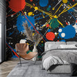 Abstract paint splash wallpaper mural in a modern minimalist living room with white furniture and natural lighting