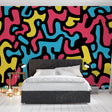 Abstract pattern wallpaper creating a bold statement wall in a modern living room with minimalist furniture