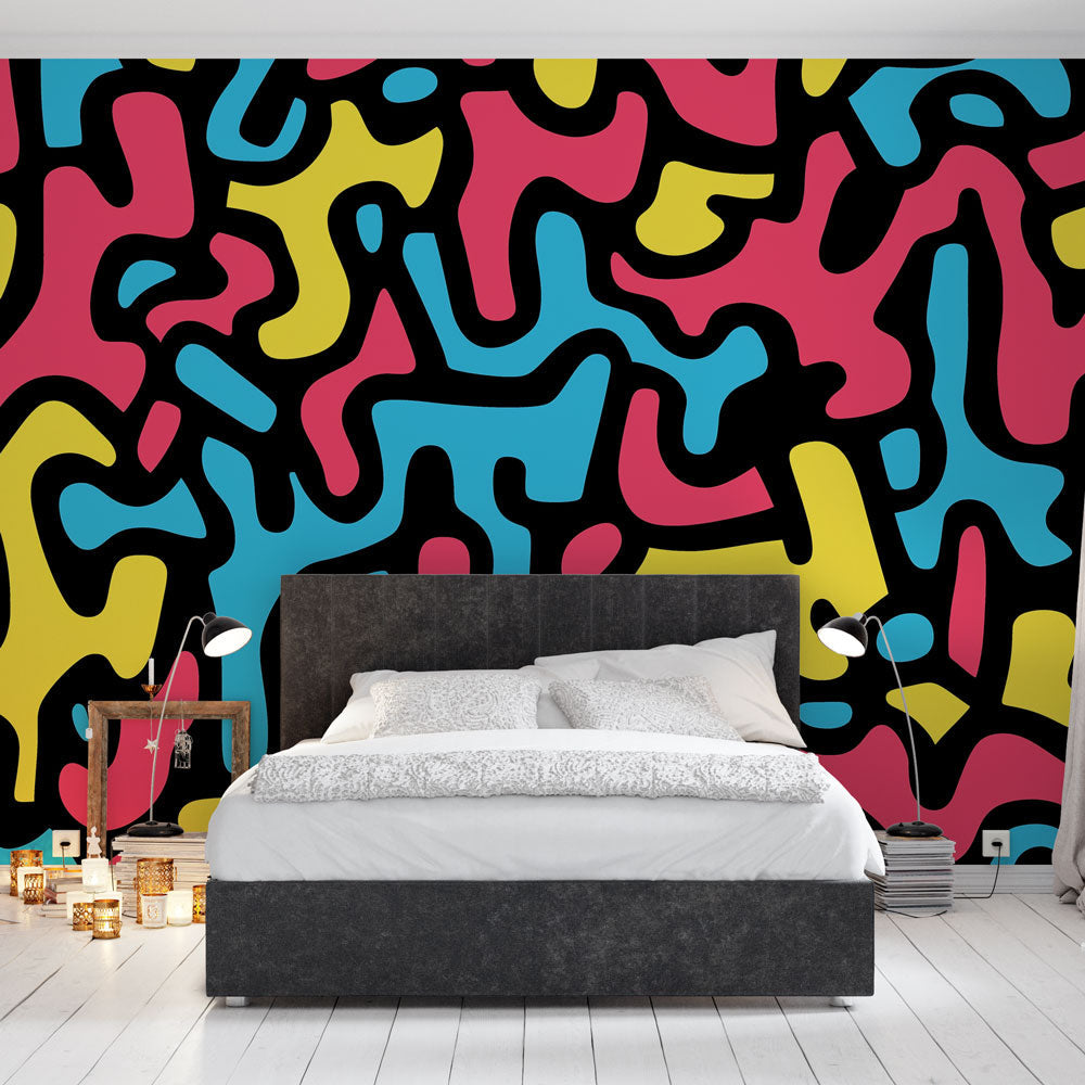 Abstract pattern wallpaper creating a bold statement wall in a modern living room with minimalist furniture