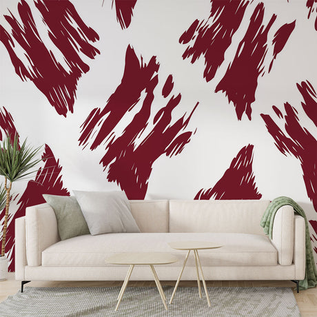 Abstract red brush stroke wallpaper creating dramatic impact in a modern living room with white furniture