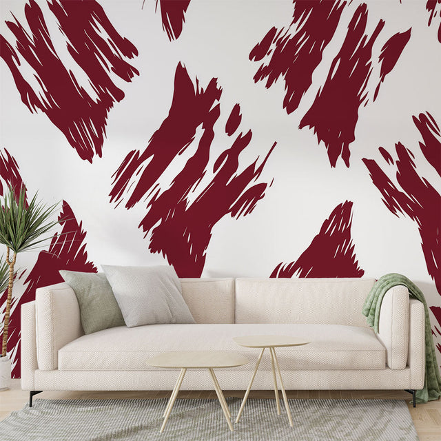Abstract red brush stroke wallpaper creating dramatic impact in a modern living room with white furniture