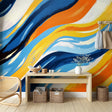 Abstract wave wallpaper with blue and orange tones shown in a modern living room setting, creating dynamic movement and energy