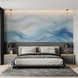 Abstract blue wave mural in minimalist bedroom showcasing flowing design
