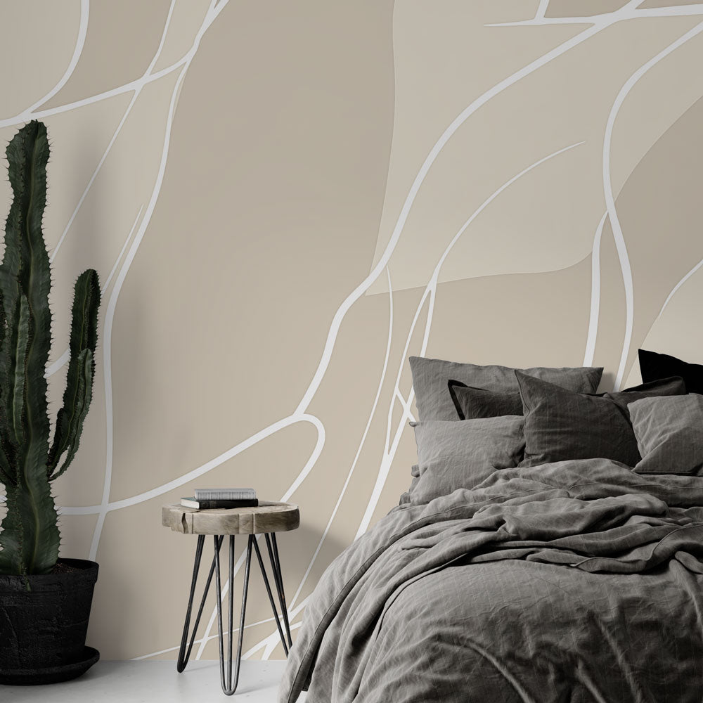 Abstract line wallpaper creating a serene atmosphere in a modern minimalist living room with beige and white flowing patterns