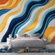 Modern abstract wave wallpaper in blue and orange creating a dynamic focal point in a minimalist living room setting