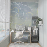Yellow and grey abstract wall mural adding movement to a minimalist bedroom setting