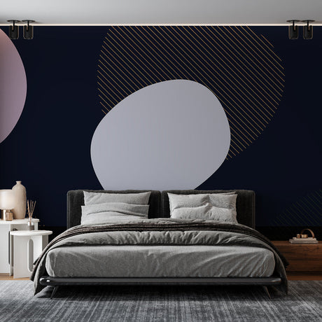 Modern geometric wallpaper with gold circles shown in a bright living room setting, creating an elegant accent wall