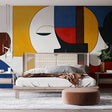 Modern living room showcasing a bold Geometric Abstract Face wallpaper mural with art deco elements and striking colors