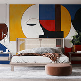 Modern living room showcasing a bold Geometric Abstract Face wallpaper mural with art deco elements and striking colors