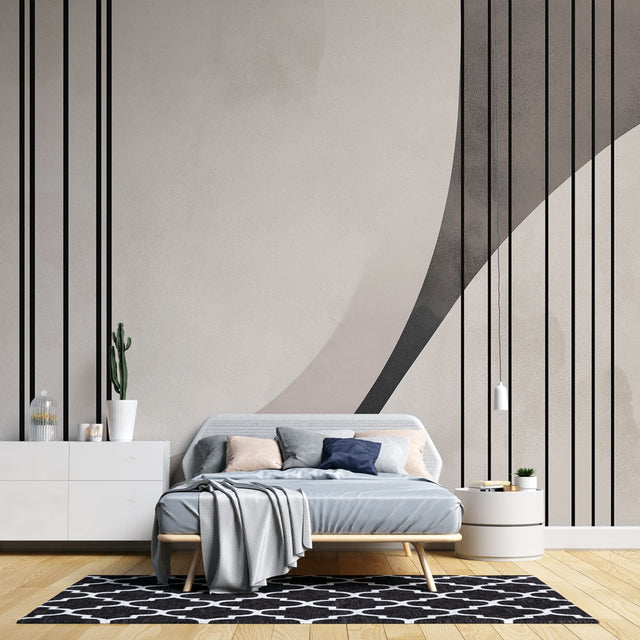 Modern geometric wallpaper with clean lines and curves creates striking impact in a minimalist living room setting