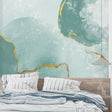 Modern living room with mint green and gold abstract wallpaper creating a fresh, airy atmosphere