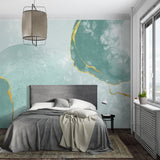 Dining room showcasing mint green abstract wallpaper with metallic gold details
