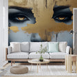 Abstract golden portrait wallpaper creating dramatic impact in a modern living room with high ceilings