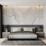 Gold wave abstract wallpaper in modern living room with grey sofa and natural light