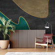 Modern green and gold geometric wallpaper in a bright living room with contemporary furniture