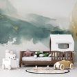 Abstract watercolor wallpaper in modern living room with green and gold tones creating a peaceful atmosphere