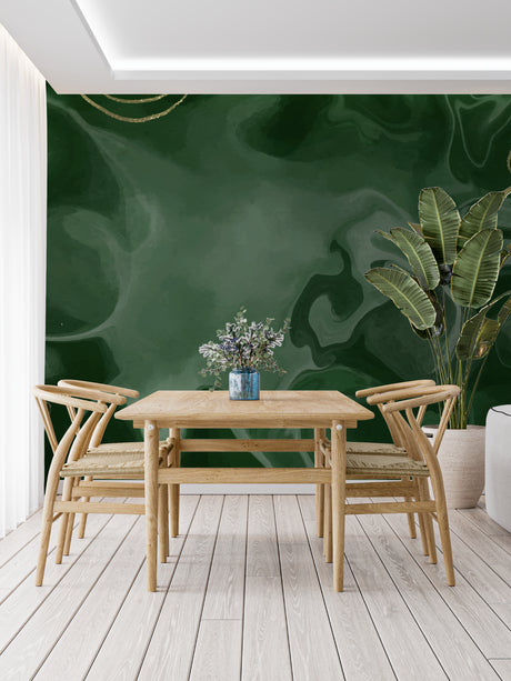 Green marble effect wallpaper with gold accents in modern living room, natural light highlighting the flowing patterns