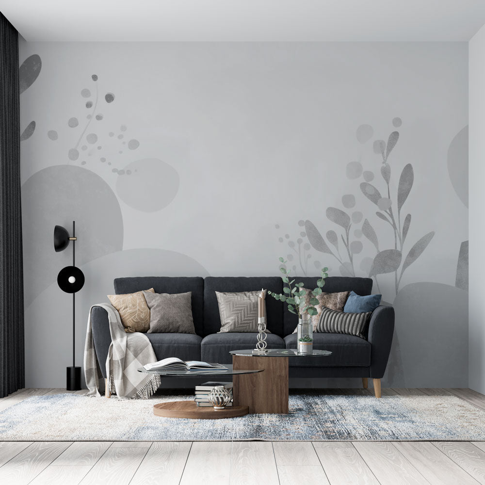 Modern grey abstract floral wallpaper creating a serene atmosphere in a minimalist living room with natural light
