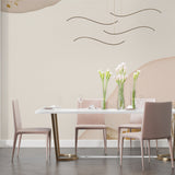 Master bedroom featuring abstract gold wave mural wallpaper with soft lighting