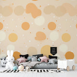 Beige and ochre circle wallpaper in dining room creating a modern, cozy atmosphere