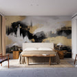 Modern black and gold abstract wallpaper creating a stunning focal point in a minimalist living room with high ceilings