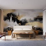 Modern black and gold abstract wallpaper creating a stunning focal point in a minimalist living room with high ceilings