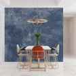 Modern blue stone effect wallpaper in a minimalist living room with gray sofa and natural light