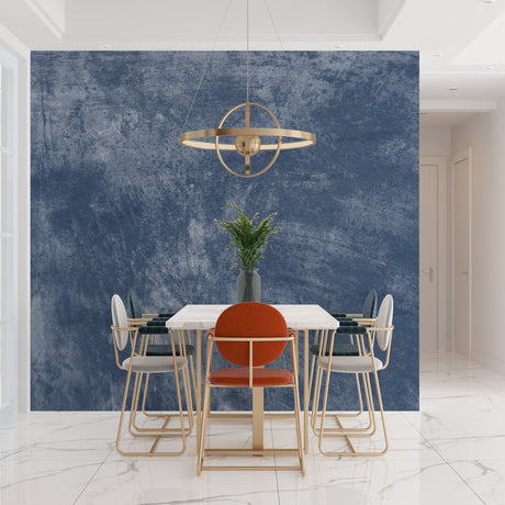 Modern blue stone effect wallpaper in a minimalist living room with gray sofa and natural light
