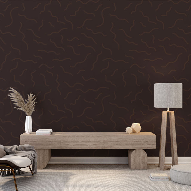 Modern brown wave pattern wallpaper displayed in a minimalist living room, creating a sophisticated focal wall