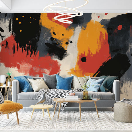 Abstract red and gold brushstroke wallpaper creating drama in a modern living room with grey sofa and minimal decor
