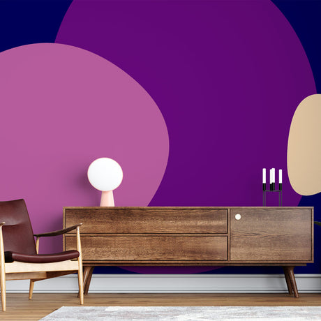Modern abstract purple circle wallpaper creating a stunning focal point in a minimalist living room with grey sofa