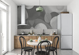 Grey geometric wallpaper adding movement to dining room walls